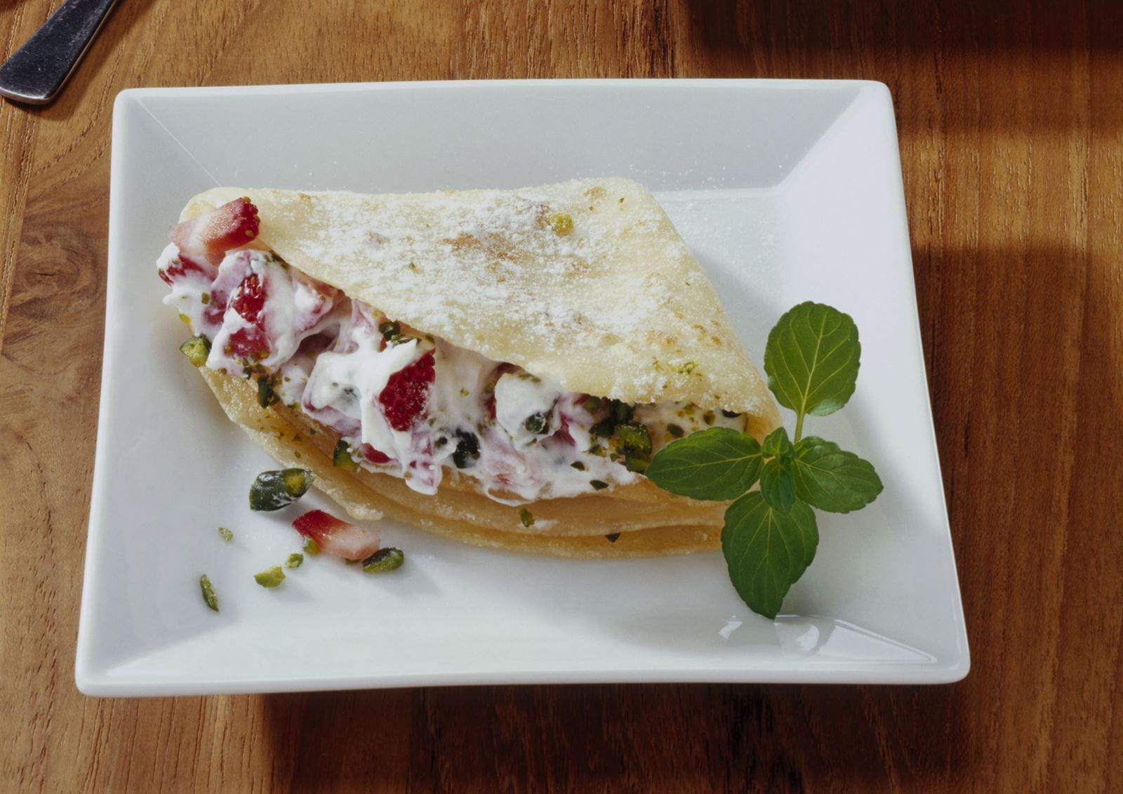 recipe image Crespelle mit Erdbeeren und Pistaziencreme